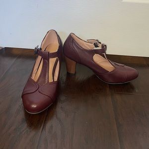 Closed-toed purple heels, size 7.5